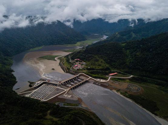 hydroelectric dam in the Andes with little water in the lake.