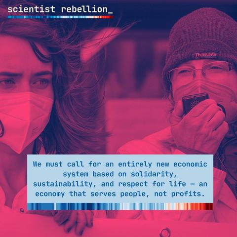 Image: two female scientists, each wearing a medical face mask, one speaking into a  megaphone.

Text box: We must call for an entirely new economic system based on solidarity, sustainability, and respect for life - an economy that serves people, not profits.